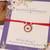 Red evil eye protection rakhi with roli chawal capsules