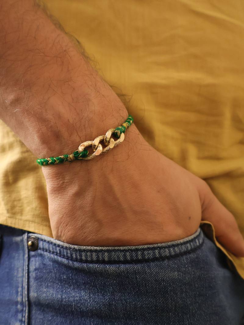 Golden chain green thread rakhi with roli chawal capsules