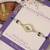 Blue peacock pearl charm rakhi with roli chawal capsules