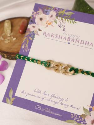 Golden chain green thread rakhi with roli chawal capsules 2
