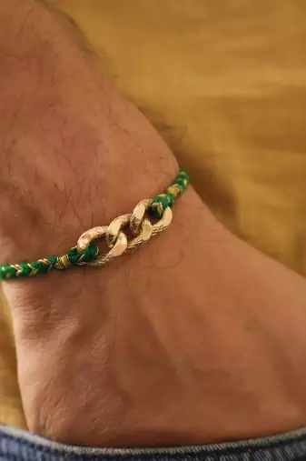 Golden chain green thread rakhi with roli chawal capsules
