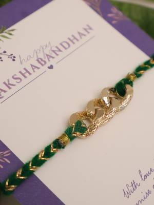 Golden chain green thread rakhi with roli chawal capsules 5