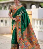 Green silk blend saree with peacock motif zari border