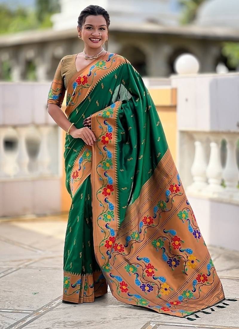 Green silk blend saree with peacock motif zari border