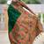 Green silk blend saree with peacock motif zari border