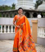 Orange silk blend saree with peacock motif zari border