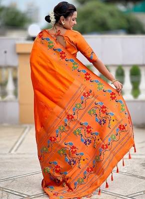 Orange silk blend saree with peacock motif zari border 2