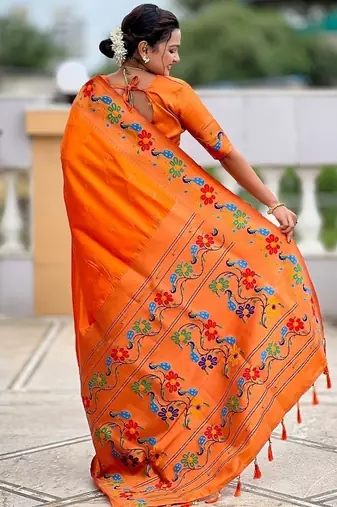 Orange silk blend saree with peacock motif zari border