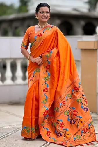Orange silk blend saree with peacock motif zari border