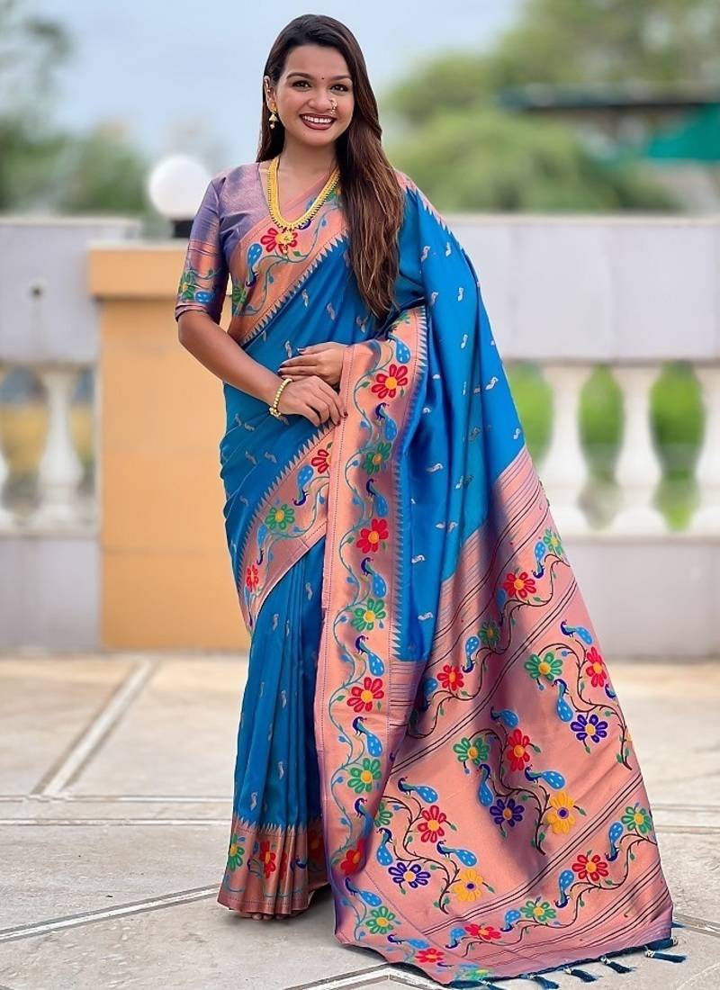Skyblue silk blend saree with peacock motif zari border