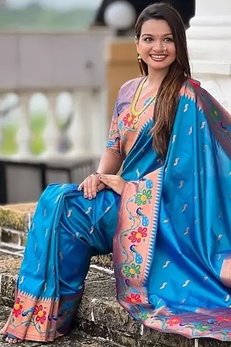 Skyblue silk blend saree with peacock motif zari border