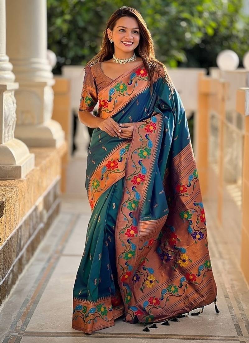 Teal silk blend saree with peacock motif zari border