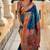 Teal silk blend saree with peacock motif zari border