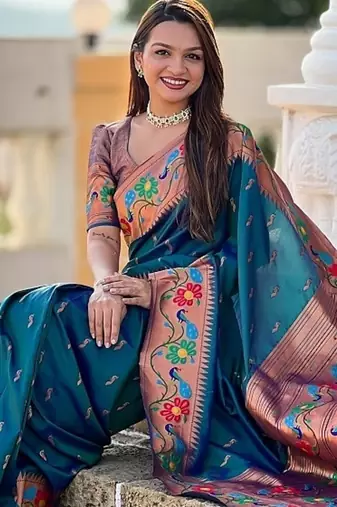 Teal silk blend saree with peacock motif zari border