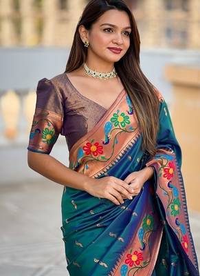 Teal silk blend saree with peacock motif zari border 5
