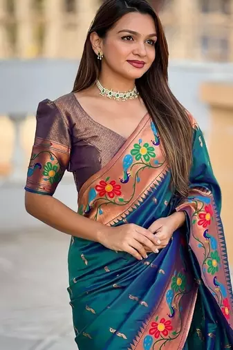 Teal silk blend saree with peacock motif zari border