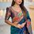 Teal silk blend saree with peacock motif zari border