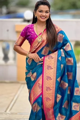 Festive firozi banarasi silk blend saree with colorful meenakari border