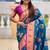 Festive firozi banarasi silk blend saree with colorful meenakari border