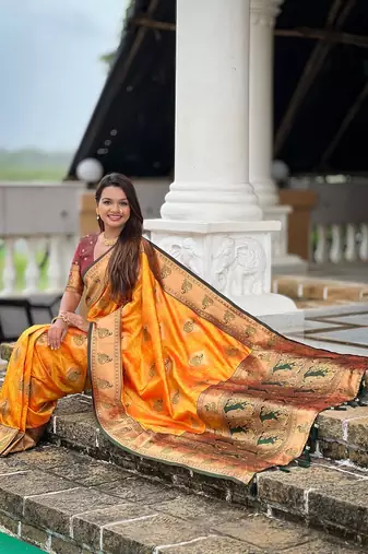 Festive mustard banarasi silk blend saree with colorful meenakari border