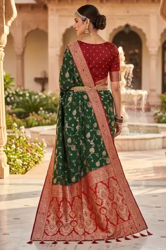 Festive darkgreen banarasi silk blend saree with colorful meenakari border