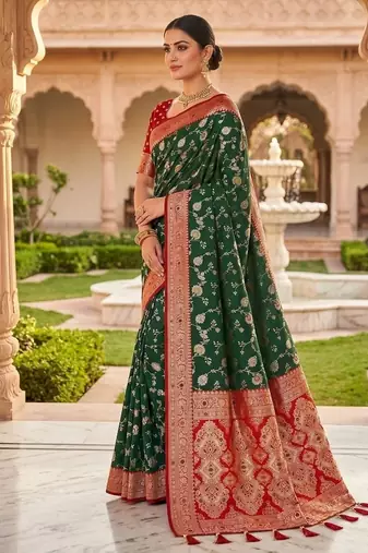 Festive darkgreen banarasi silk blend saree with colorful meenakari border