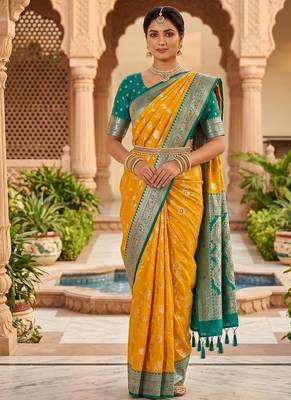 Festive yellow banarasi silk blend saree with colorful meenakari border 1