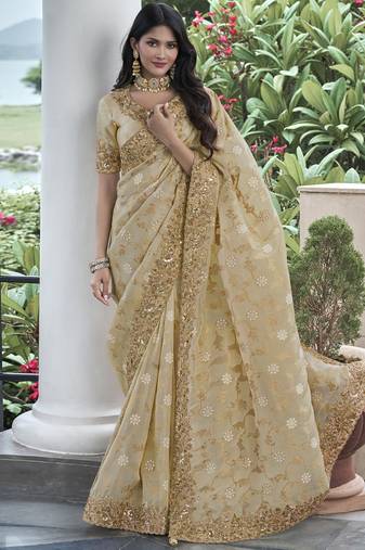 Cream silk heavy embroidered wedding saree