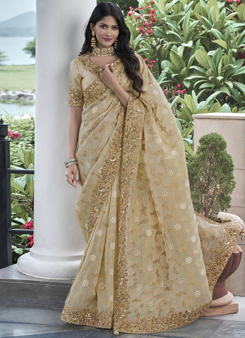 Cream silk heavy embroidered wedding saree