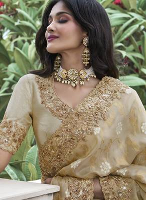 Cream silk heavy embroidered wedding saree 2