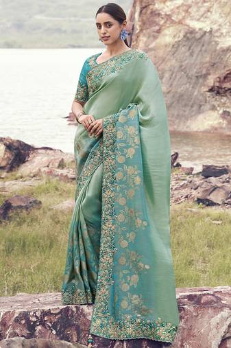 Light-green ndturquoise zari weaving heavy embroidered wedding saree