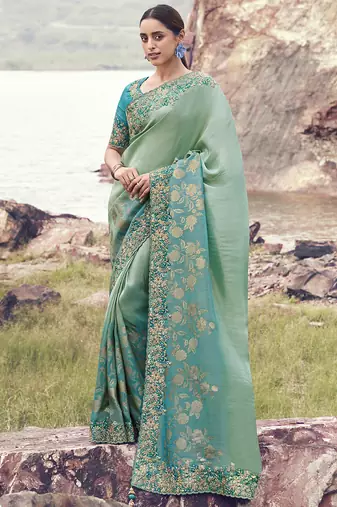 Light-green ndturquoise zari weaving heavy embroidered wedding saree
