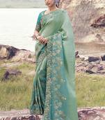 Light-green ndturquoise zari weaving heavy embroidered wedding saree