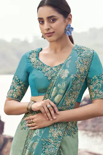 Light-green ndturquoise zari weaving heavy embroidered wedding saree