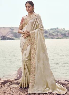 Cream zari weaving heavy embroidered wedding saree 1
