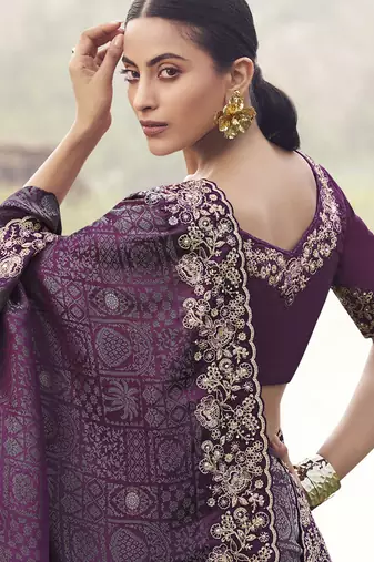 Purple zari weaving heavy embroidered wedding saree