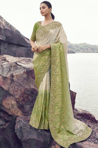 Off white nd light green zari weaving heavy embroidered wedding saree