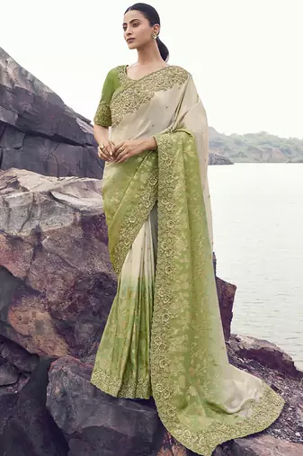 Off white nd light green zari weaving heavy embroidered wedding saree