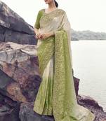 Off white nd light green zari weaving heavy embroidered wedding saree