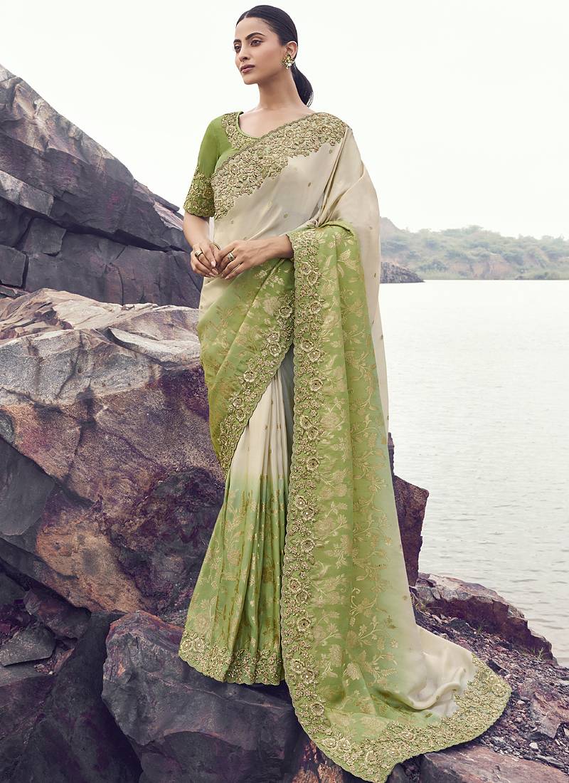 Off white nd light green zari weaving heavy embroidered wedding saree