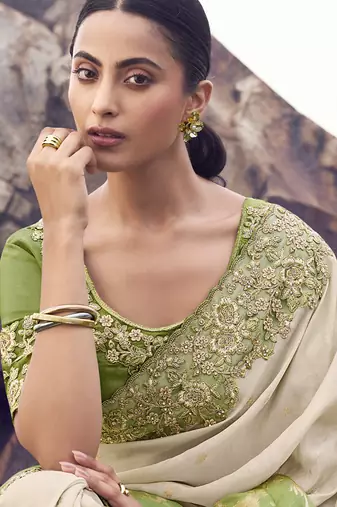 Off white nd light green zari weaving heavy embroidered wedding saree