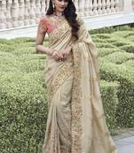 Cream silk heavy embroidered wedding saree