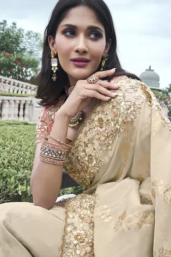 Cream silk heavy embroidered wedding saree