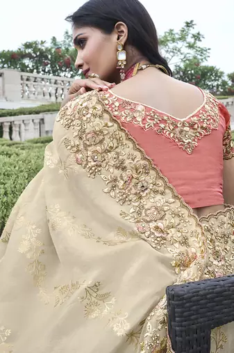 Cream silk heavy embroidered wedding saree