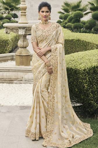 Cream silk heavy embroidered wedding saree