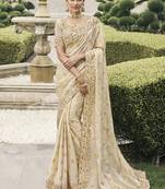 Cream silk heavy embroidered wedding saree
