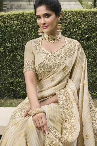 Cream silk heavy embroidered wedding saree