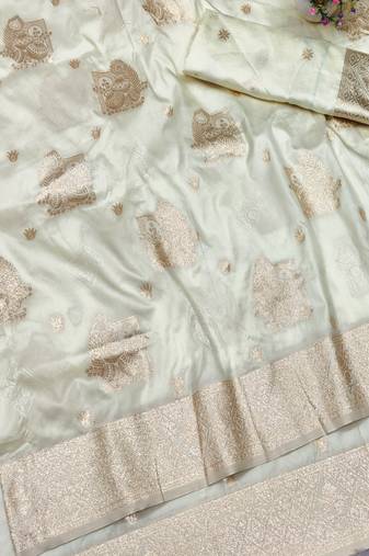 Cream zari woven baluchari silk traditional saree with blouse piece