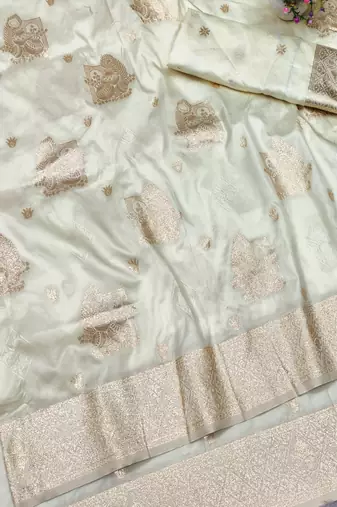 Cream zari woven baluchari silk traditional saree with blouse piece