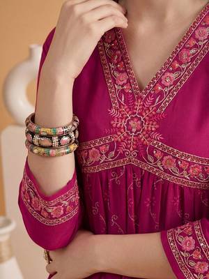 Embroidered v-neck alia cut kurta & trousers 5